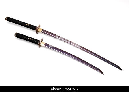Katana and wakizashi Japanese swords isolated in white background. Stock Photo