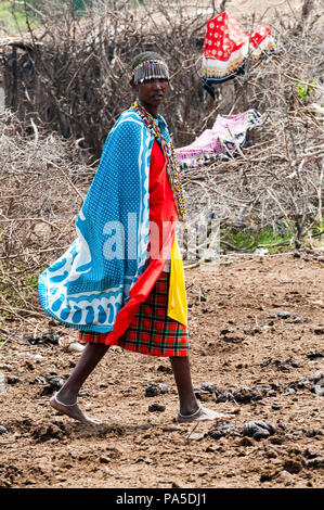 AMBOSELI, KENYA - OCTOBER 10, 2009: Unidentified Massai woman wearing tribal typical clothes in Kenya, Oct 10, 2009. Massai people are a Nilotic ethni Stock Photo