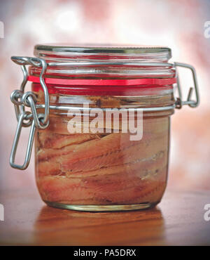 Anchovies fillets in glass jar Stock Photo