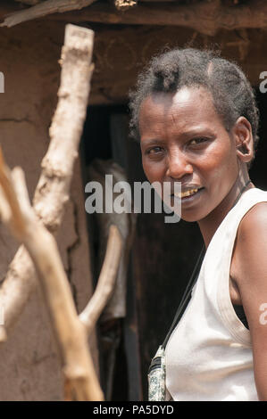 AMBOSELI, KENYA - OCTOBER 10, 2009: Portrait of an unidentified Massai smiling woman in Kenya, Oct 10, 2009. Massai people are a Nilotic ethnic group Stock Photo