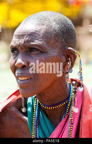 AMBOSELI, KENYA - OCTOBER 10, 2009: Portrait of an unidentified Massai woman with earings in Kenya, Oct 10, 2009. Massai people are a Nilotic ethnic g Stock Photo