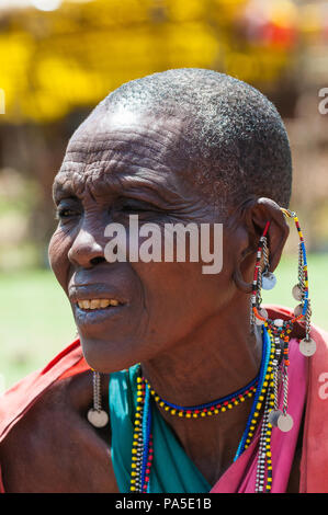 AMBOSELI, KENYA - OCTOBER 10, 2009: Portrait of an unidentified Massai woman with earings in Kenya, Oct 10, 2009. Massai people are a Nilotic ethnic g Stock Photo