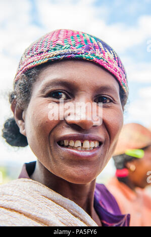 MADAGASCAR - JUNE 30, 2011: Portrait of an unidentified woman in Madagascar, June 30, 2011. People of Madagascar suffer of poverty due to the unstable Stock Photo