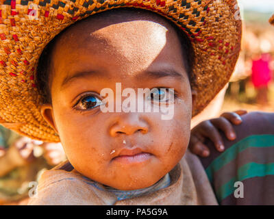 Little girl in sombrero hat at home 