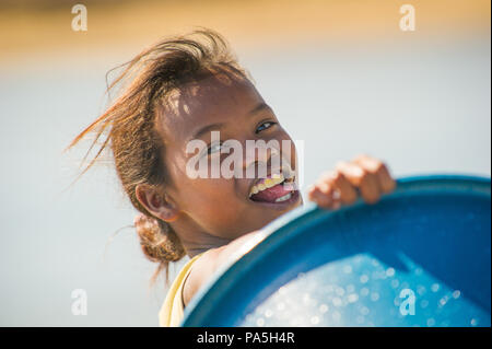 MADAGASCAR - JULY 5, 2011: Portrait of an unidentified beautiful girl in Madagascar, July 5, 2011. Children of Madagascar suffer of poverty due to the Stock Photo