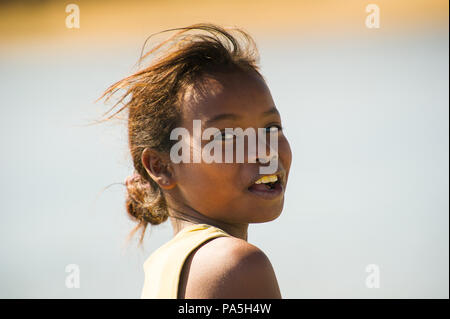 MADAGASCAR - JULY 5, 2011: Portrait of an unidentified beautiful girl in Madagascar, July 5, 2011. Children of Madagascar suffer of poverty due to the Stock Photo