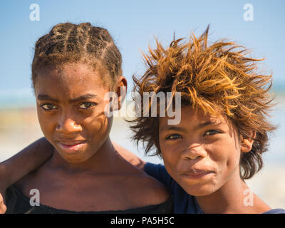 MADAGASCAR - JULY 5, 2011: Portrait of an unidentified brother and sister in Madagascar, July 5, 2011. Children of Madagascar suffer of poverty due to Stock Photo