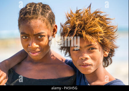 MADAGASCAR - JULY 5, 2011: Portrait of an unidentified brother and sister in Madagascar, July 5, 2011. Children of Madagascar suffer of poverty due to Stock Photo