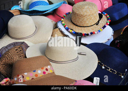 Selection of Women's Hats for sale and on display on sale at a market held each week in Beziers, France Stock Photo