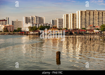 George Town, Penang, Malaysia - Jan 6, 2018: Landscape view at the jetties and the city of George Town buildings at the background. Stock Photo