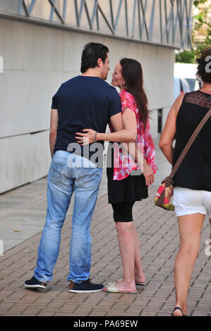 Young couple saying goodbye to each other in Beziers, France Stock Photo