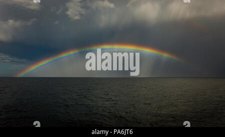 Storm clouds and rainbow over the North Sea Stock Photo