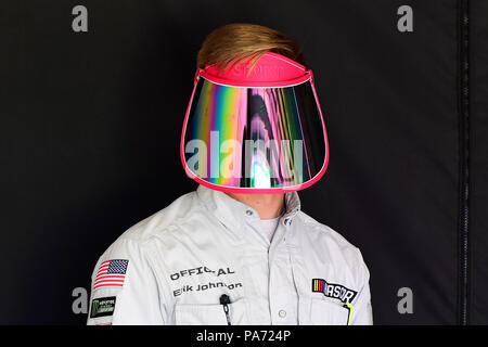 Loudon, New Hampshire, USA. 20th July, 2018. NASCAR official Erik Johnson wears a safety shield outside of the inspection booth during an inspection period before practice at the Monster Energy Foxwoods Resort Casino 301 at the New Hampshire Motor Speedway in Loudon, New Hampshire. Eric Canha/CSM/Alamy Live News Stock Photo