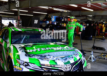 Loudon, New Hampshire, USA. 20th July, 2018. Kyle Busch, driver of the #18 Interstate Batteries Toyota, waits in the garage before a practice session at the NASCAR Monster Energy Foxwoods Resort Casino 301 race at the New Hampshire Motor Speedway in Loudon, New Hampshire. Eric Canha/CSM/Alamy Live News Stock Photo