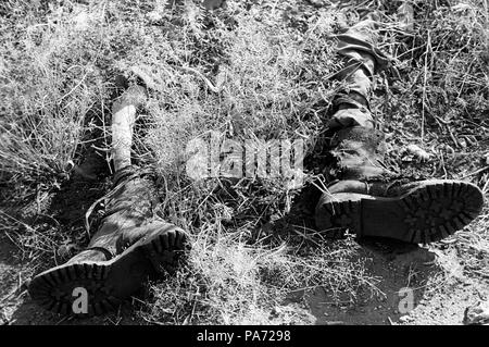 Tserona, Eritrea. 2nd Nov, 1999. The leg bones of an Ethiopian soldier protrude from his boots along the Eritrean trenches at Egri Mikhal on the border near Tserona. Credit: Cheryl Hatch/ZUMAPRESS.com/Alamy Live News Stock Photo