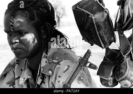 Tserona, Eritrea. 2nd Nov, 1999. A young Eritrean soldier, TSEGA, stands watch at the front at Tserona. She symbolizes a second-generation soldier, with her modern hairstyle and military fatigues. The liberation fighters wore Afros and plain khaki shorts and navy blue short-sleeve shirts. Credit: Cheryl Hatch/ZUMAPRESS.com/Alamy Live News Stock Photo