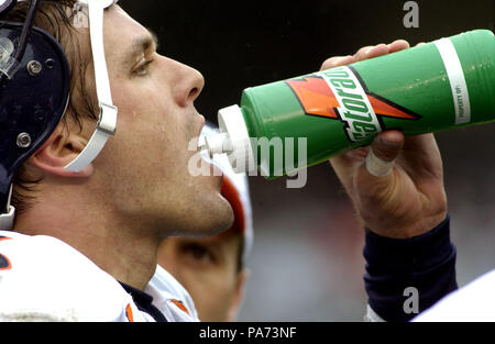 Denver Broncos quarterback Jake Plummer throws a short pass to running back Tatum  Bell for a one-yard loss against the Oakland Raiders in the first quarter  at Invesco Field in Denver September