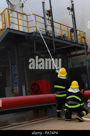 Haikou, China's Hainan Province. 21st July, 2018. Firemen take part in a LNG carrier rescue drill held by Haikou maritime bureau in Chengmai County, south China's Hainan Province, July 21, 2018. Credit: Yang Guanyu/Xinhua/Alamy Live News Stock Photo