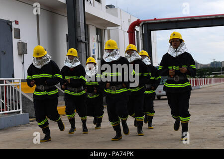 Haikou, China's Hainan Province. 21st July, 2018. Firemen take part in a LNG carrier rescue drill held by Haikou maritime bureau in Chengmai County, south China's Hainan Province, July 21, 2018. Credit: Yang Guanyu/Xinhua/Alamy Live News Stock Photo