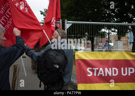 Glasgow, Scotland, on 21 July 2018. A counter demonstration by United Against Facism supporters, during a protest by the far right Scottish Defence League, in George Square, Glasgow, Scotland.  Mounted police and police with dogs separated the two groups as the Scottish Defence League espoused their anti-immigrant rhetoric and accused immigrants of running grooming gangs. Image credit: Alamy News. Stock Photo