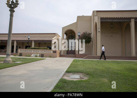 Visalia, California, USA. 18th July, 2018. Fresno County Prosecutor, Andrew Janz tours the campus of his high school, Redwood High School, in Visalia, California on July 18, 2018. Janz, a Democrat, is challenging Devin Nunes (R-CA) in the California 22nd Congressional District election in November. Credit: Alex Edelman/ZUMA Wire/Alamy Live News Stock Photo