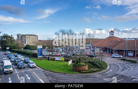 Old multi story warehouse and large supermarket car park and store  in County Way, Trowbridge, Wiltshire, UK taken on 25 January 2018 Stock Photo