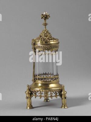Reliquary. Culture: Hungarian. Dimensions: Overall: 4 7/16 x 2 1/16 x 2 1/16 in. (11.3 x 5.2 x 5.2 cm). Date: ca. 1500.  The small size of this reliquary suggests that it was made for a wealthy private owner so that, in his private devotions, he could view a relic of his patron saint through the crystal.  The rich surface decoration is similar to that of other objects known to have been made in Hungary in the early 16th century. Museum: Metropolitan Museum of Art, New York, USA. Stock Photo