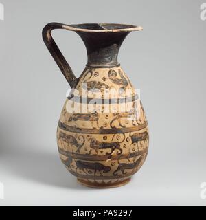 Terracotta oinochoe:olpe (jug). Culture: Greek, Corinthian. Dimensions: H. 14 5/16 in. (36.4 cm). Date: ca. 630-615 B.C..  Four friezes with animals  Olpai were greatly favored by Corinthian artists, particularly during the last three decades of the seventh century. The decoration consists almost exclusively of animal friezes; there are virtually no examples with narrative figural subjects. Museum: Metropolitan Museum of Art, New York, USA. Stock Photo