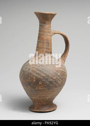 Terracotta jug. Culture: Cypriot. Dimensions: H. 6 3/8 in. (16.2 cm). Date: ca. 1450-1200 B.C..  Narrow-necked jug with handle, with white binding pattern. Museum: Metropolitan Museum of Art, New York, USA. Stock Photo