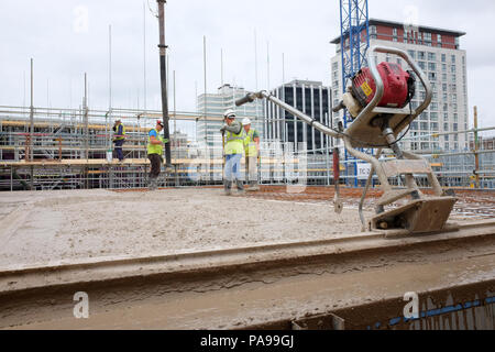 July 2018 - Laying a concrete slab on a British construction site Stock Photo