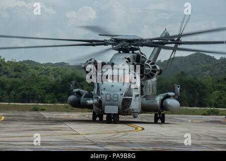 A U.S. Marine CH-53E Super Stallion helicopter with Special Purpose Marine Air-Ground Task Force - Southern Command taxis on the flight line in Flores, Guatemala, after returning from a flight to Soto Cano Air Base, Honduras, July 5, 2018. The Marines and sailors of SPMAGTF-SC are conducting security cooperation training and engineering projects alongside partner nation military forces in Central and South America. The unit is also on standby to provide humanitarian assistance and disaster relief in the event of a hurricane or other emergency in the region. (U.S. Marine Corps photo by Sgt. Jus Stock Photo