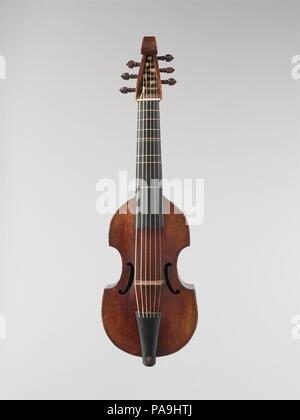 Treble Viol. Culture: French. Dimensions: Body length:  34.5 cm.  Body width:  upper bout 16.5 cm.    center bout 11.2 cm.   lower bout  19.5 cm.  Rib height:  top block:  5.4 cm.  center bout 6.95 cm  bottom block 7/15 cm.  String length:  37.0 cm.. Maker: Jean Ouvrard (French, Paris ca. 1720-1748 Paris). Date: 1726.  This treble viol retains its original neck, fingerboard, and tailpiece, and is a rare example of a professional musician's instrument in unaltered condition. Viols were the most esteemed bowed instruments of the late Renaissance, and only gradually displaced by the violin fa Stock Photo