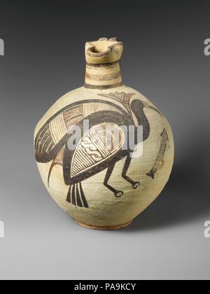 Terracotta jug. Culture: Cypriot. Dimensions: 11 1/16in. (28.1cm)  Other (rim): 2 15/16in. (7.5cm). Date: 750-600 B.C..  The decoration consists of a bird with a lotos flower that appears to grow from between the wings and an arrow directed upward. Although all of the motifs are frequent on Cypro-Archaic vases in various combinations,  the meaning is unknown, The effect, however, is decorative thanks especially to the masterful placement of the bird over the bulbous body of the jug. Museum: Metropolitan Museum of Art, New York, USA. Stock Photo