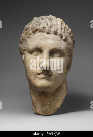 Marble head of a Hellenistic ruler. Culture: Roman. Dimensions: H. 14 9/16 in. (37 cm.). Date: 1st-2nd century A.D..  Copy or adaptation of a Greek portrait of the early 3rd century B.C.  The flat fillet worn by this young man is an insignium of kingship. He has been identified as one of the Macedonian Greek kings who ruled the new kingdoms formed in the lands that Alexander the Great had conquered in the late fourth century B.C. The head was once part of the collection of antiquities formed in the early seventeenth century in Rome by the Marchese Vincenzo Giustiniani. Museum: Metropolitan Mus Stock Photo