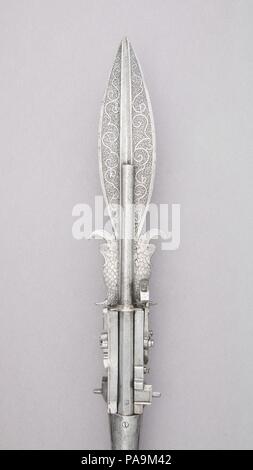 Boar Spear with Double Barrel Wheellock Pistol. Culture: German. Dimensions: L. 89 3/4 in. (227.96 cm); L. of head 40 1/2 in. (102.9 cm); L. of barrel 12 in. (30.5 cm); W. 4 in. (10.2 cm); Cal. (a) .412 in. (10.47 mm); Cal. (b) .415 in. (10.54 mm); Wt. 9 lbs. 6 oz. (4252.4 g). Date: late 16th century. Museum: Metropolitan Museum of Art, New York, USA. Stock Photo