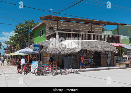 Sandy street on the coast of the Atlantic ocean. House with white ...