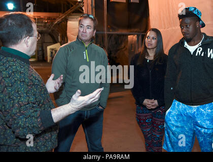 Steven Johnson, NFL linebacker for the Tennessee Titans, his wife  Stephanie, and Craig Domann, receive a tour from Steven Rose, 721st Mission  Support Group deputy director, during a visit to Cheyenne Mountain