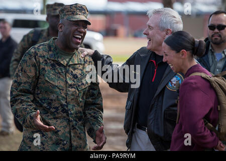 Secretary of the Navy Ray Mabus, center, speaks with Sgt. Maj. of the Marine Corps Ronald Green, left, and 1st Lt. Terri L. Piekosz, a series commander with November Company, 4th Recruit Training Battalion, March 3, 2016, on Parris Island, S.C. Mabus visited Marine Corps Recruit Depot Parris Island in order to see firsthand how young men and women from across the country are transformed into United States Marines. Recruit training was consolidated under Recruit Training Regiment in 1986, and since then, all those desiring to complete recruit training must follow the same training program of in Stock Photo
