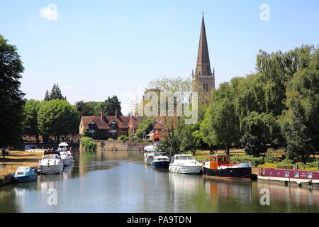 Boats on the River Thames at Abingdon, Oxfordshire UK with St Helen's church in background Stock Photo