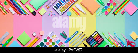 School Supplies With Colorful Paper Background - Education Banner Stock Photo
