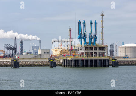 LNG transshipment terminal in harbor Rotterdam, biggest seaport of Europe Stock Photo