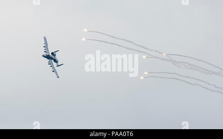An A-10 Thunderbolt II releases flares over Grand Bay Bombing and Gunnery Range at Moody Air Force Base, Ga., March 4, 2016. Multiple U.S. Air Force aircraft within Air Combat Command conducted joint aerial training that showcased the aircraft's tactical air and ground maneuvers, as well as its weapons capabilities. (U.S. Air Force photo by Staff Sgt. Brian J. Valencia/Released) Stock Photo