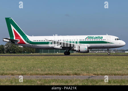 Italian Alitalia A320-200 with Irish registration EI-DTO just landed on runway 18R (Polderbaan) of Amsterdam Airport Schiphol. Stock Photo