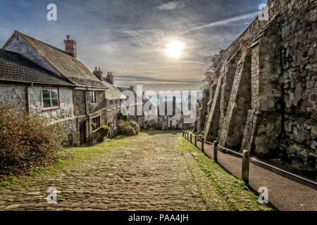 Famous Gold Hill in Shaftesbury with sun in sky taken in Shaftebury, Dorset, UK on 3 January 2017 Stock Photo