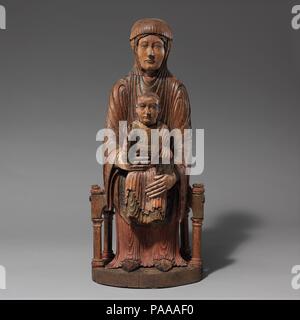 Enthroned Virgin and Child. Culture: French. Dimensions: 27 × 11 1/4 × 11 in. (68.6 × 28.6 × 27.9 cm). Date: 1150-1200.  The stark and rhythmic lines of this sculpture are almost modern in their effect. In fact, this seemingly straightforward image of the infant Jesus seated rigidly on the Virgin's lap represents a complex, medieval theological notion known as a Sedes Sapientiae (Throne of Wisdom), in which Mary serves as a throne for Christ, who in turn embodies divine wisdom. Placed on an altar, this imposing group was an object of veneration that could also be carried in procession or incor Stock Photo