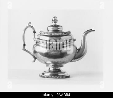 Teapot. Culture: American. Dimensions: Overall: 9 3/8 x 11 5/16 x 5 3/8 in. (23.8 x 28.7 x 13.7 cm); 23 oz. 19 dwt. (745.5 g)  Foot: 4 13/16 x 4 3/16 in. (12.2 x 10.6 cm). Maker: Garrett Eoff (1779-1845). Date: ca. 1825. Museum: Metropolitan Museum of Art, New York, USA. Stock Photo