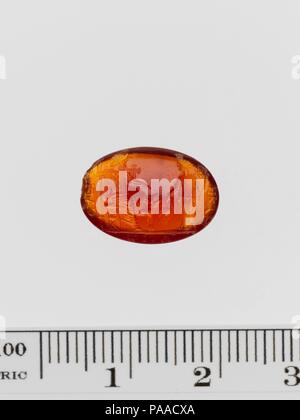 Carnelian ring stone. Culture: Roman. Dimensions: Length: 9/16 in. (1.5 cm). Date: 1st-2nd century A.D..  Serapis-Hades with Isis before him and Kerberos by his side.  Adaptation of a Greek work of the 4th century B.C. Museum: Metropolitan Museum of Art, New York, USA. Stock Photo