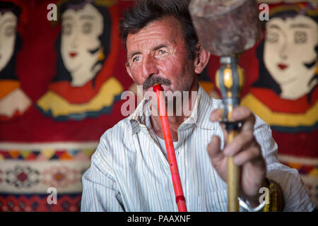 Portrait of smoking Qashqai man , nomad people, Iran Stock Photo
