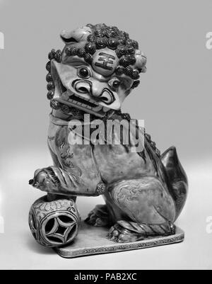 Figure of a Lion. Culture: China. Dimensions: H. 9  1/2 in. (24.1 cm); W. 7 1/2 in. (19.1 cm). Museum: Metropolitan Museum of Art, New York, USA. Stock Photo