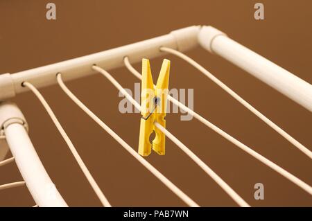 Isolated colored clothespins on the clotheshorse (Pesaro, Italy, Europe) Stock Photo